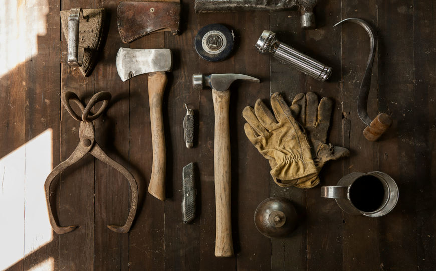 a flat lay of tools on a workbench